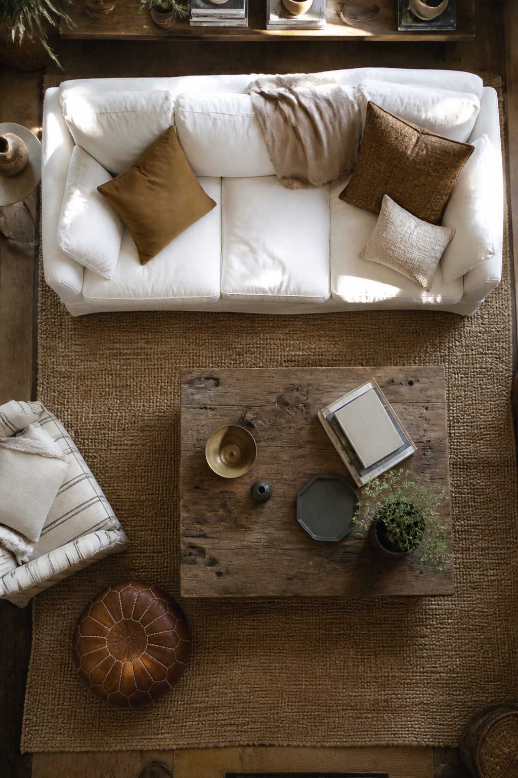 A white sofa surrounded by warm wood tones and rich textures.